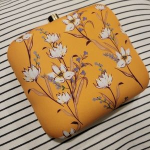 Orange floral clutch with detachable chain